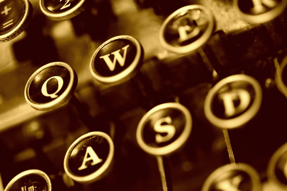 aged typwriter keys in antique sephia tones.jpeg